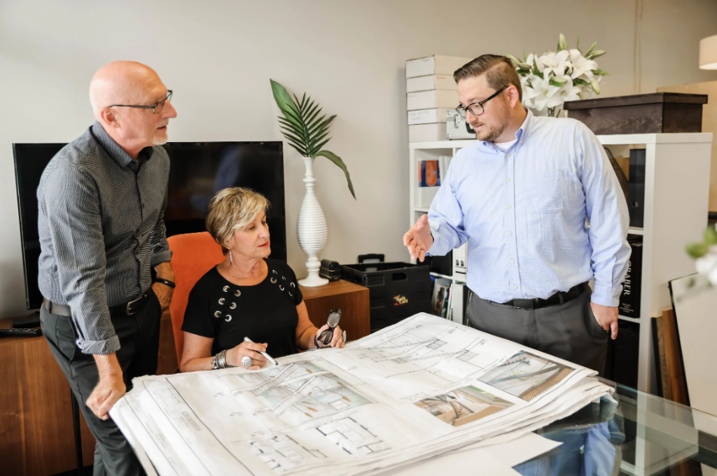 AA+I team reviewing architectural drawings