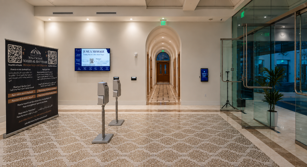 Interior of The Islamic Center of Orlando prayer hall with domed ceiling, gold mihrab, and teal prayer carpet