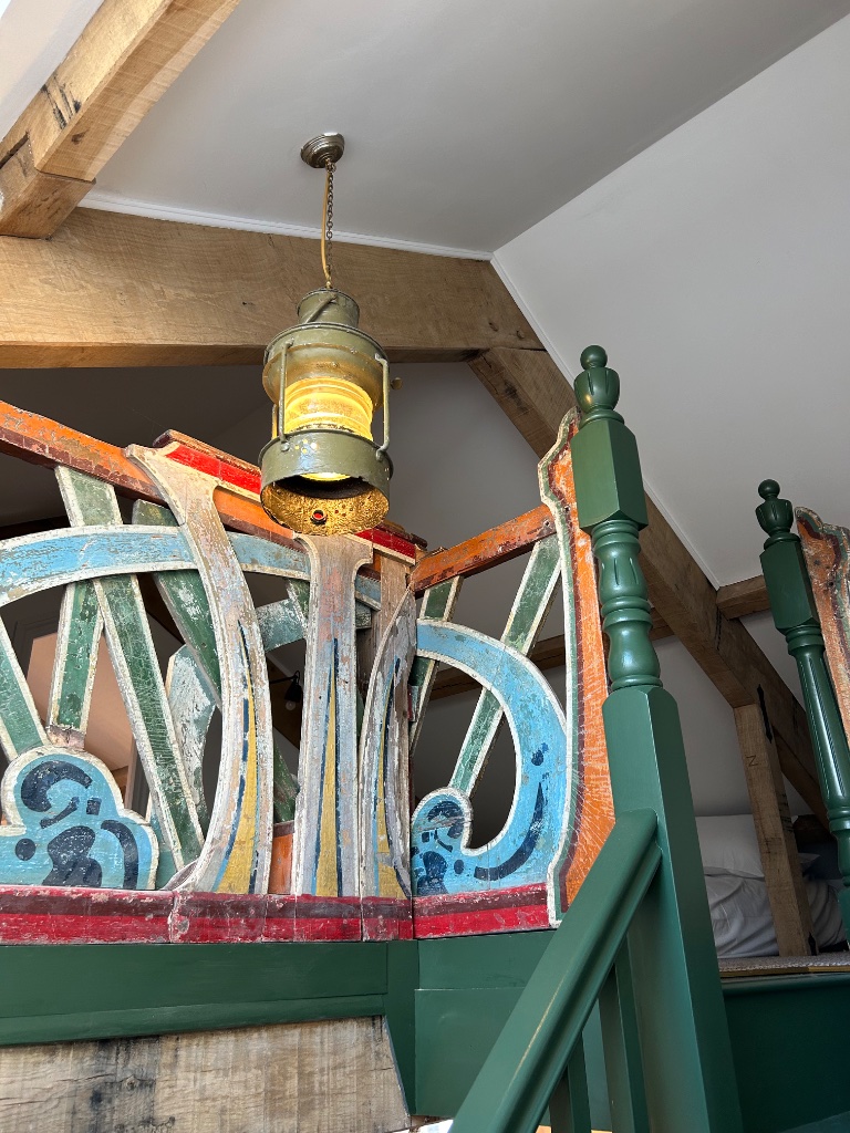 Antique ship's lantern - rewired and suspended from mezzanine beam