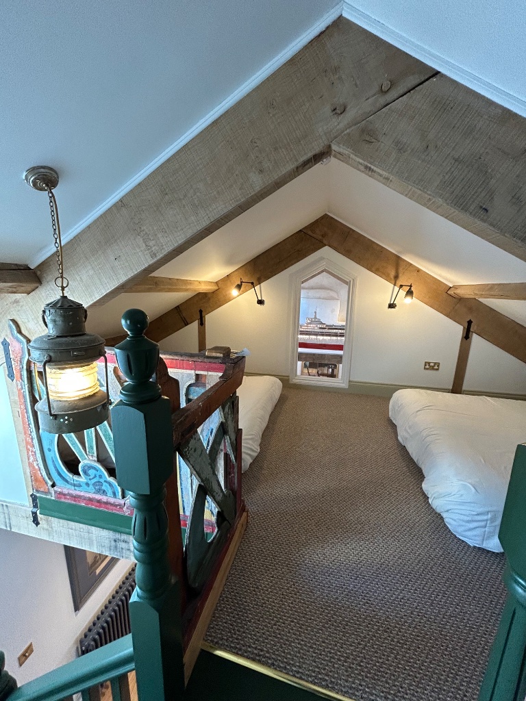 Twin room - reading wall lights and view through to Canberra replica