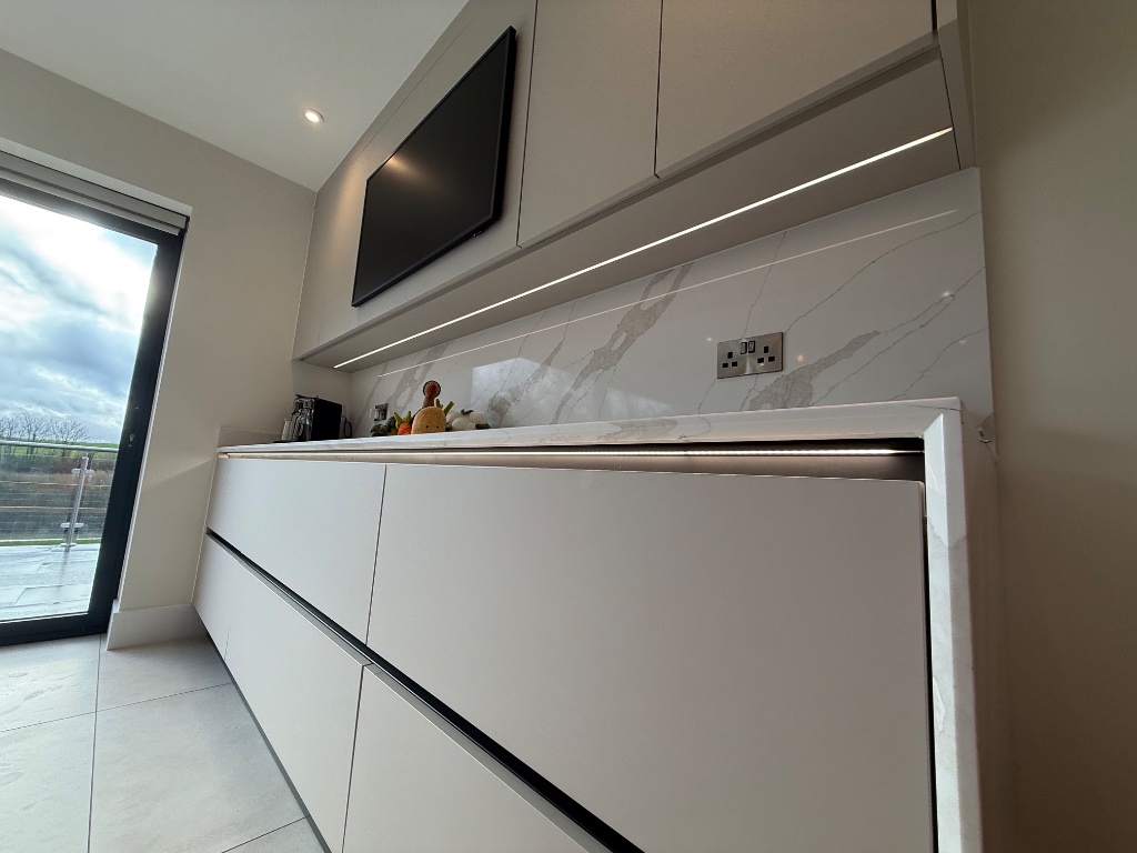 Kitchen - bespoke LED strip lighting integrated into cabinetry