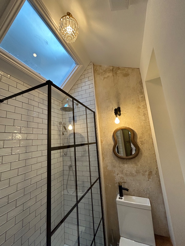 En-suite - crystal semi-flush fitting and antique wall light