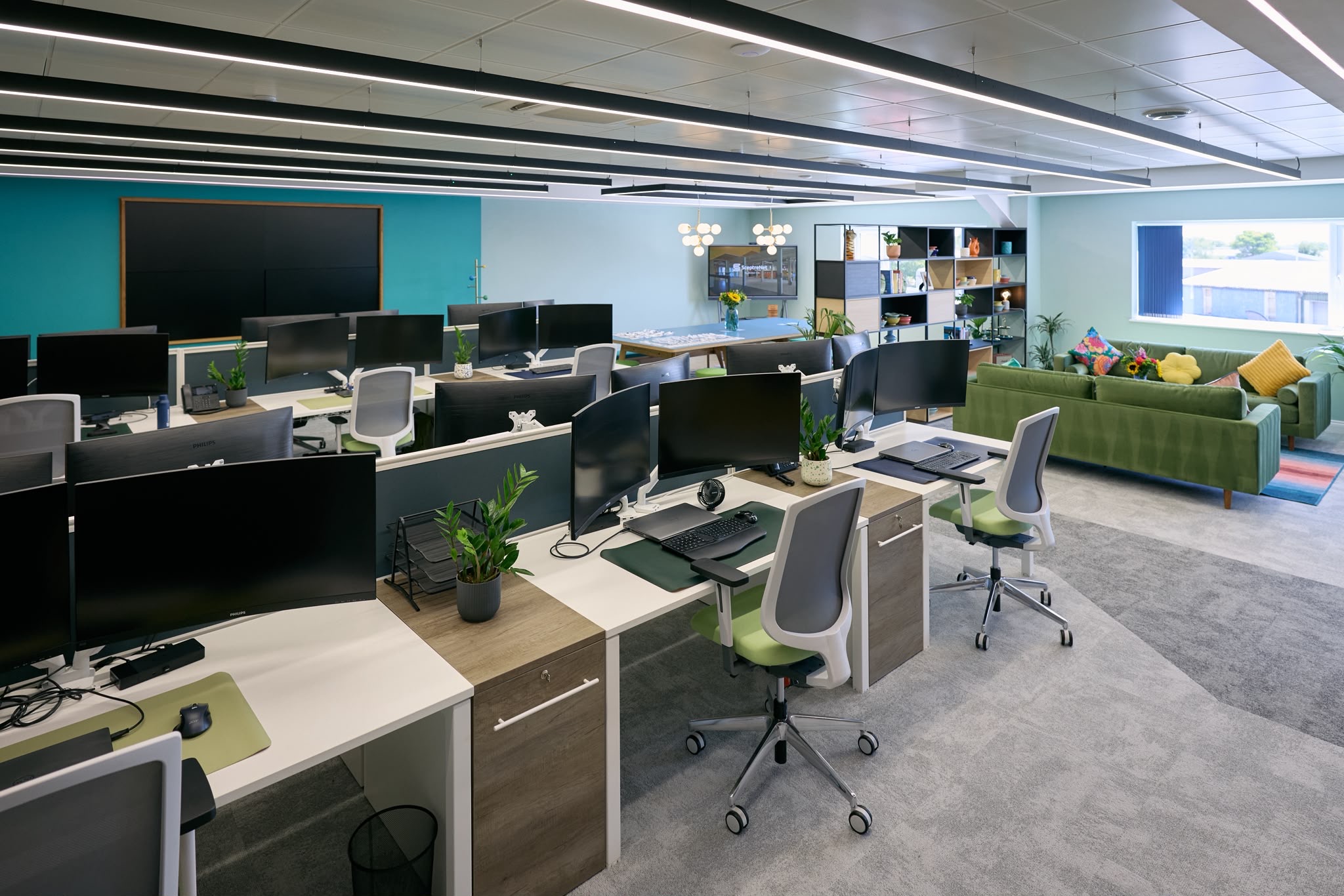 Open-plan office with rows of suspended linear LED fittings, Sceptre Net commercial electrical project