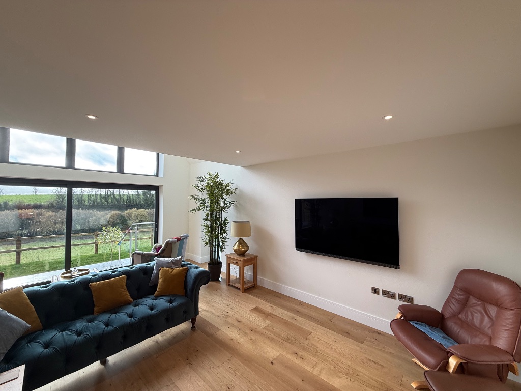 Living room - recessed lighting, media wall supply and network points