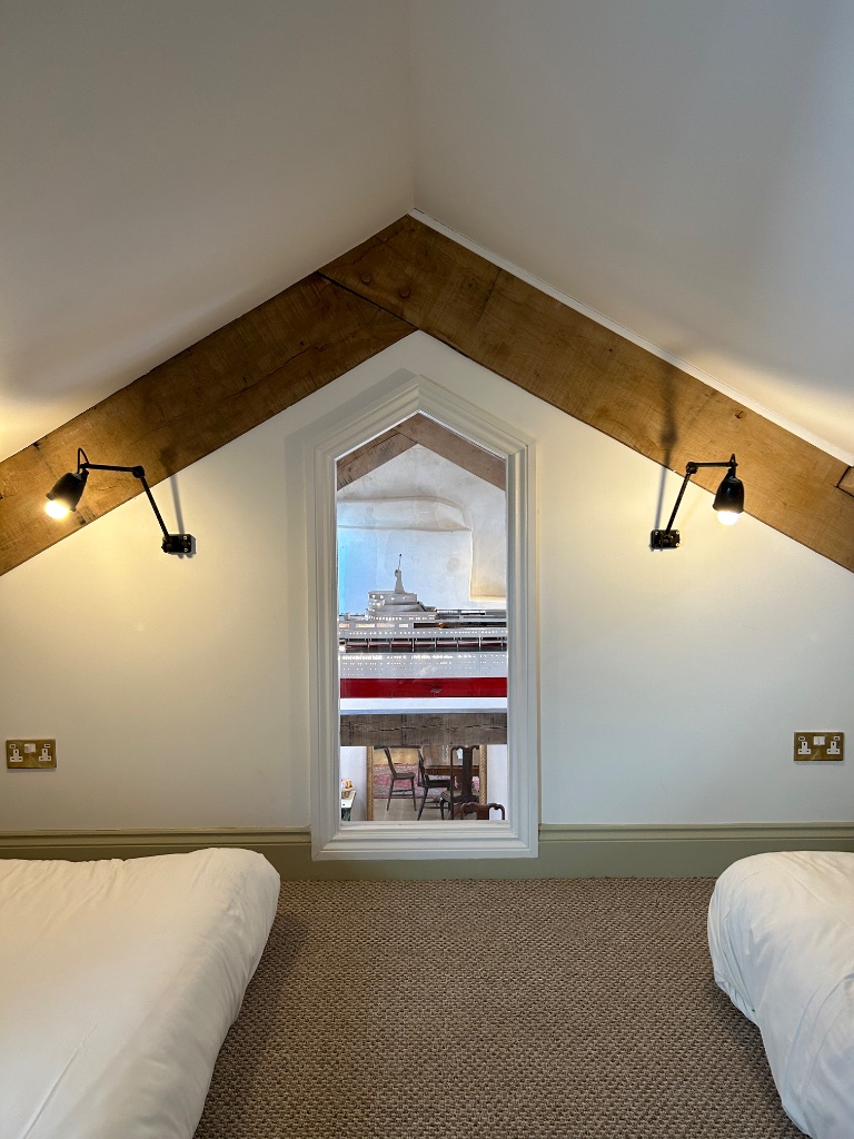 Twin room - gothic arched window overlooking Canberra replica below