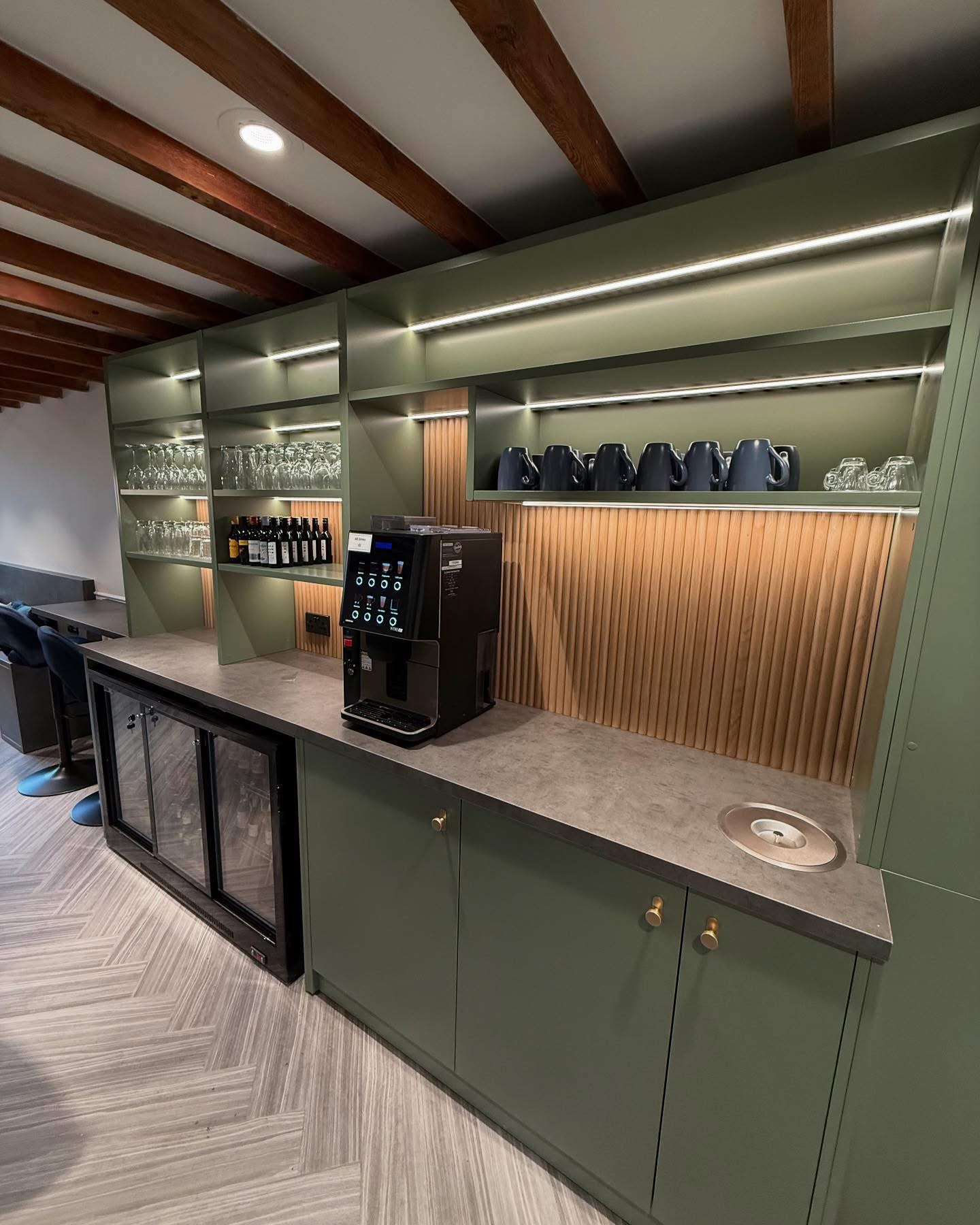 Sage green bar unit with integrated under-shelf LED lighting