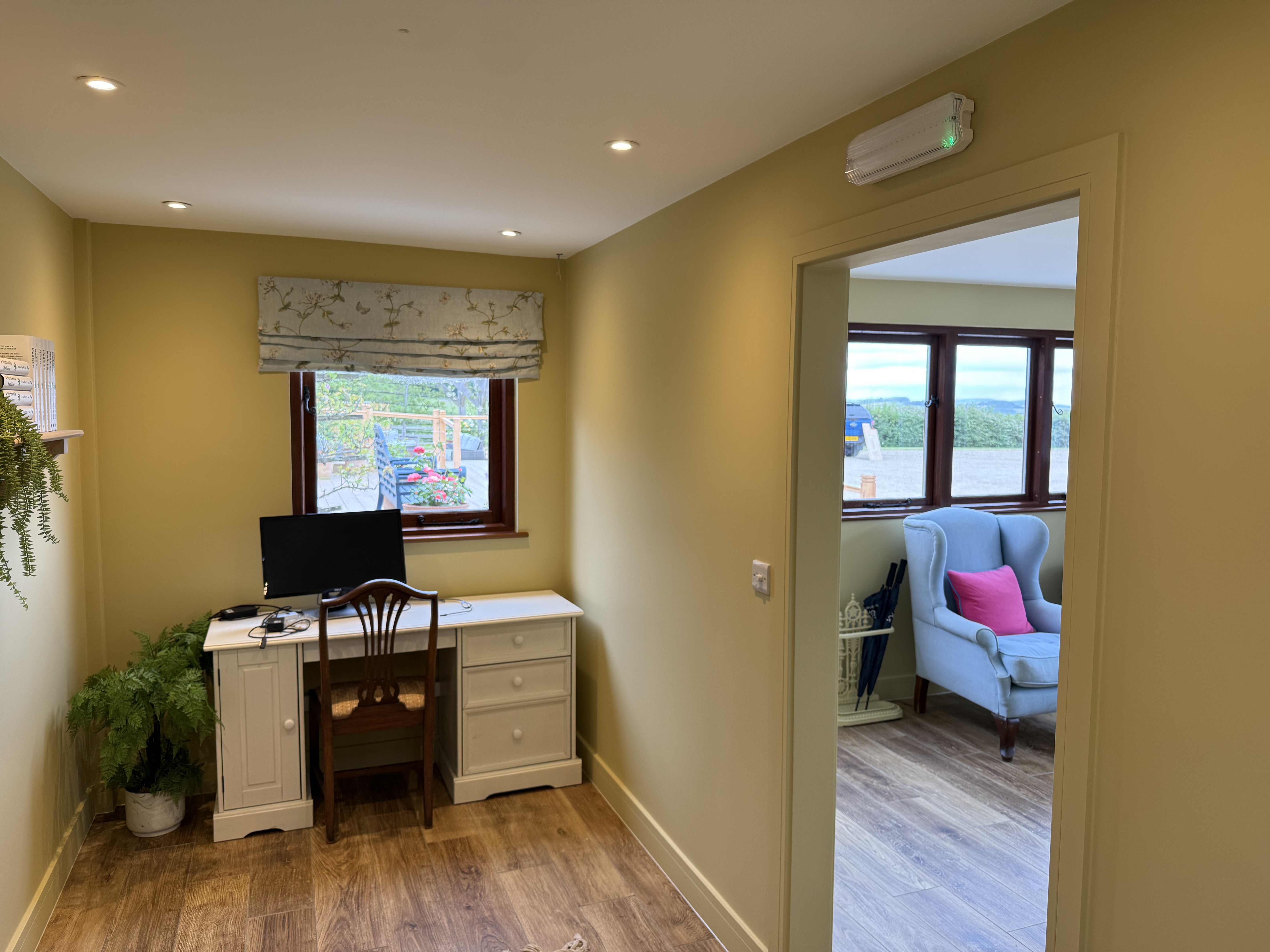 Office area with automatic door sensor and recessed spotlights