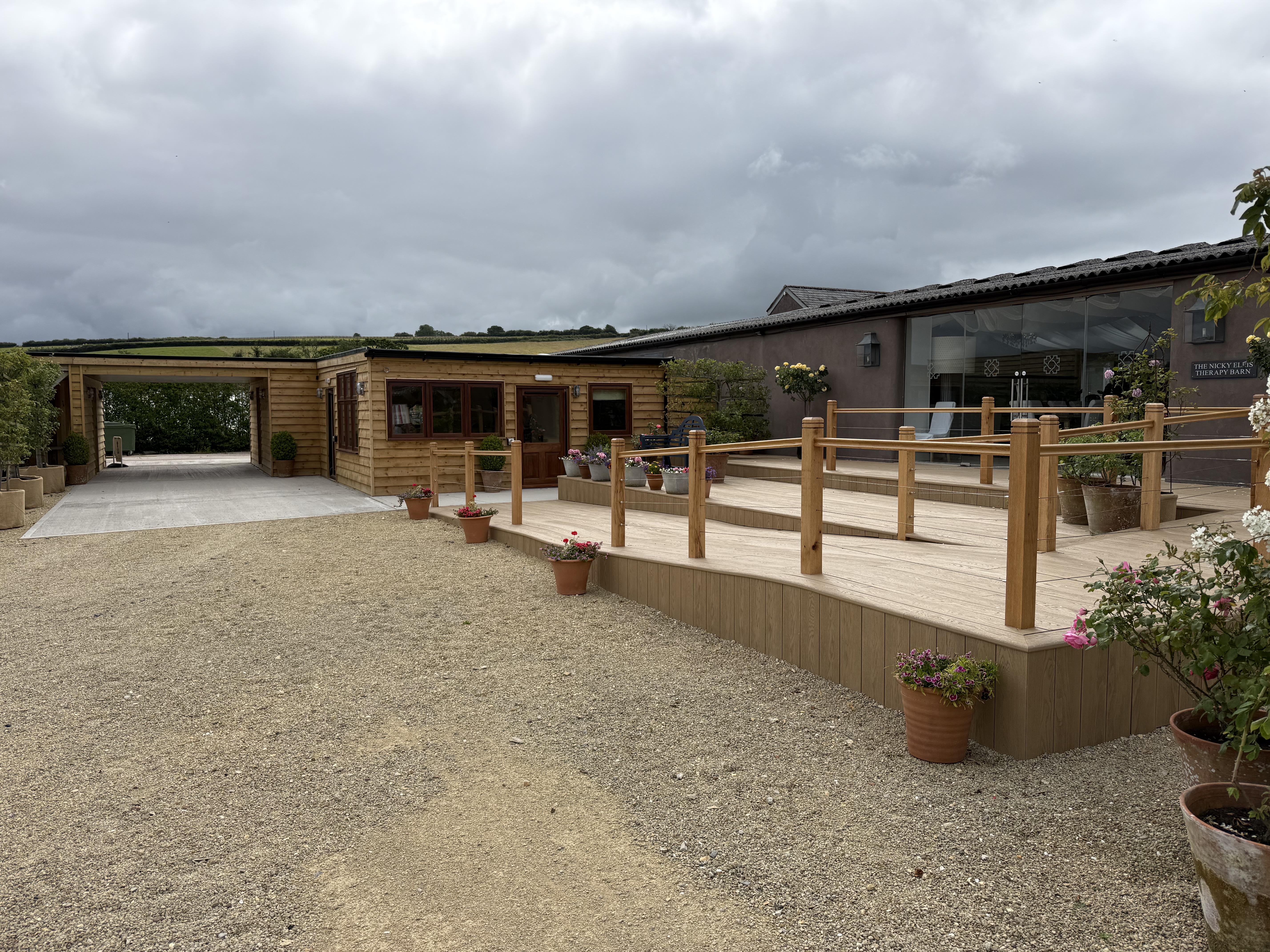 New reception entrance with composite decking ramp and timber cladding