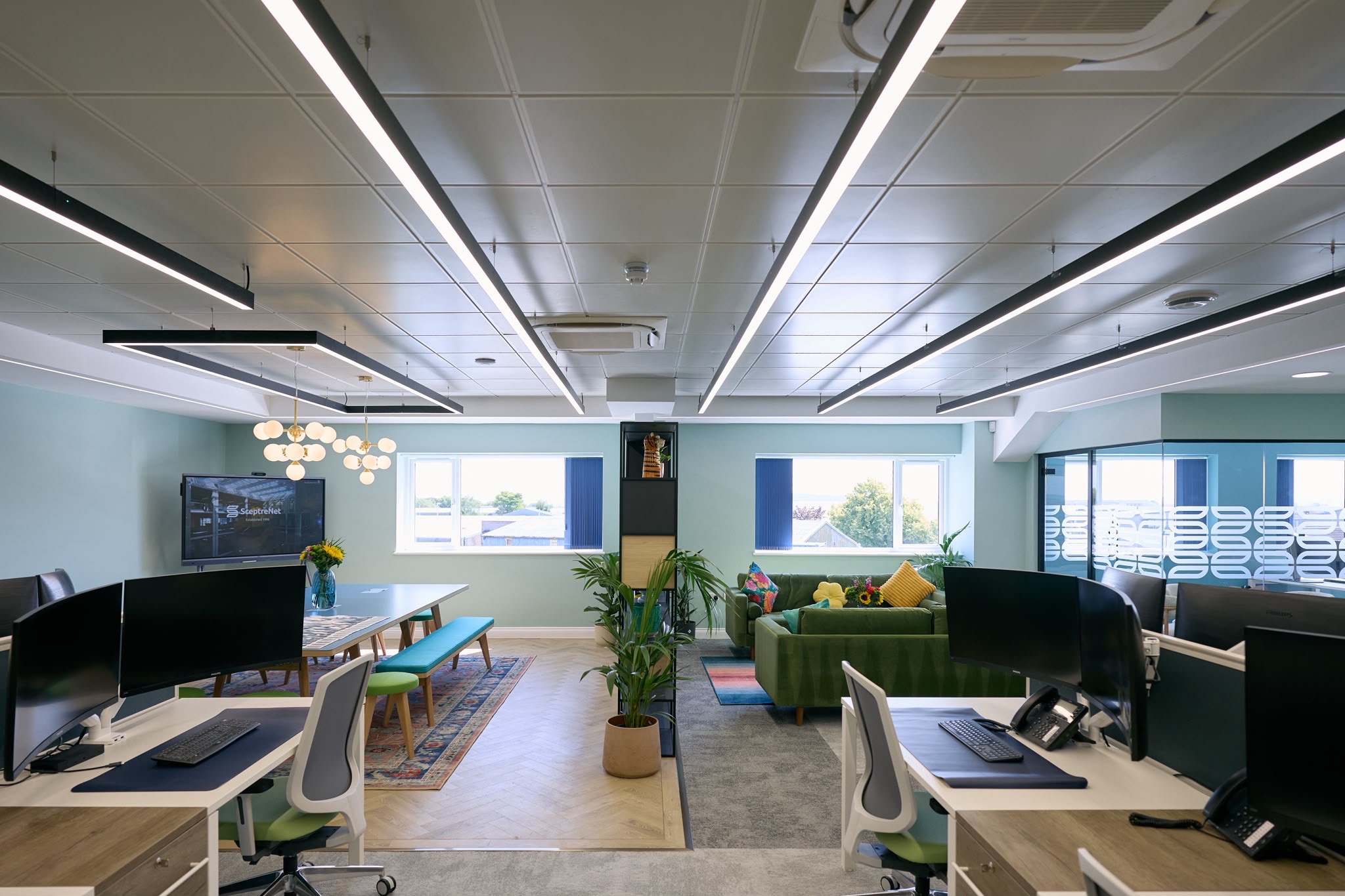 SceptreNet open-plan workspace with suspended linear LED lighting by Relay Electrical Services