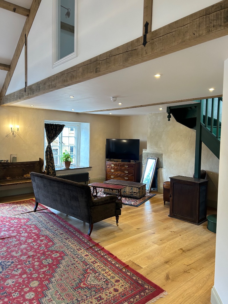 Living room - recessed downlights and antique wall sconce