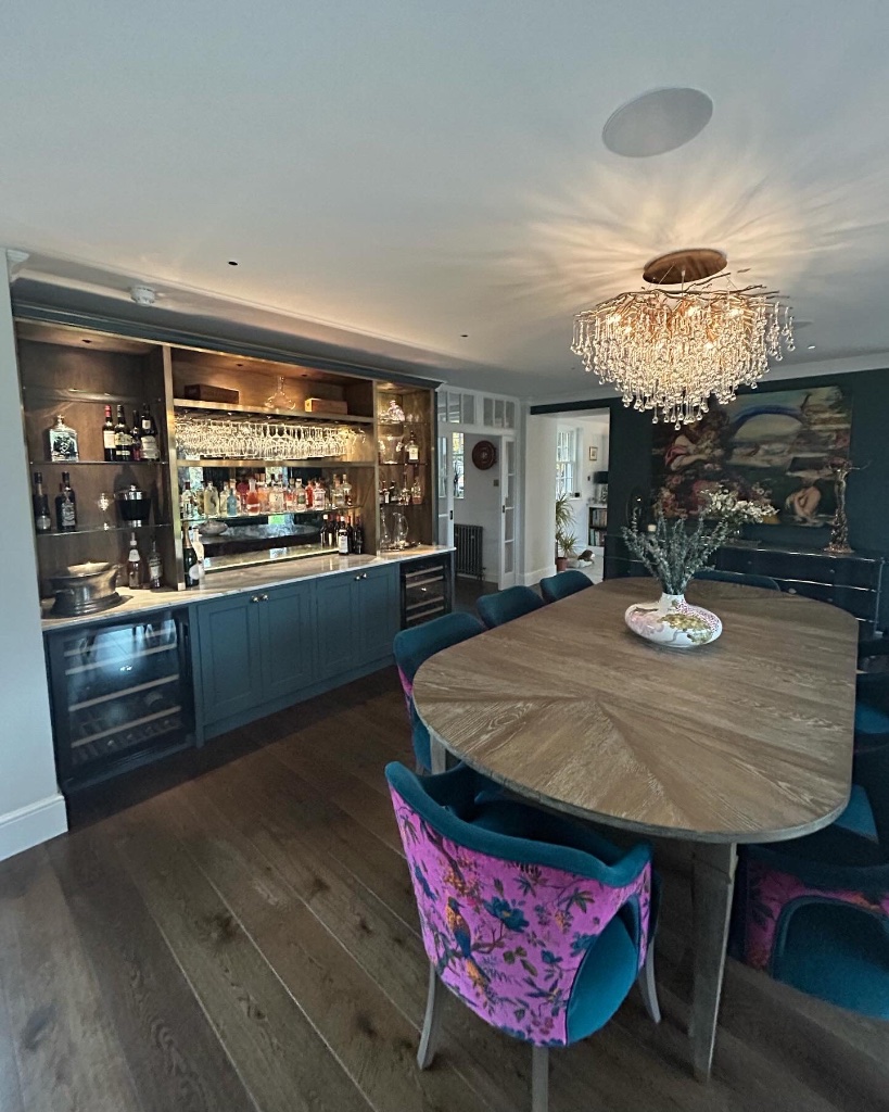Garden room with panoramic glazing and recessed lighting