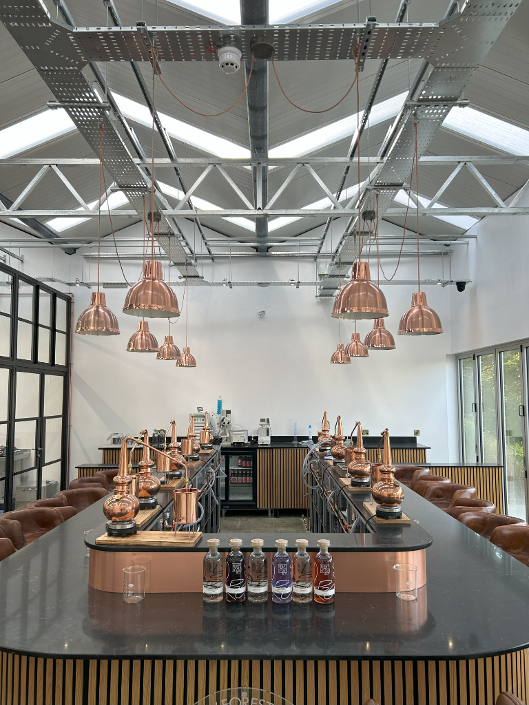 Distillery floor - copper stills and glazed partition