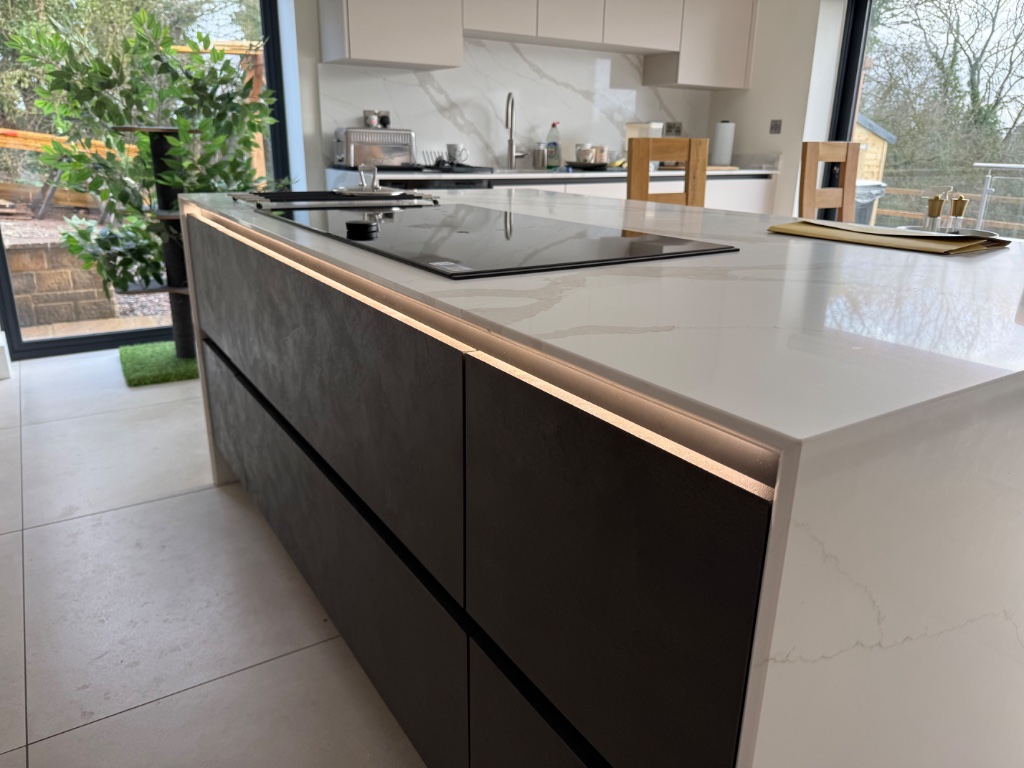 Kitchen island - integrated LED lighting and induction hob supply