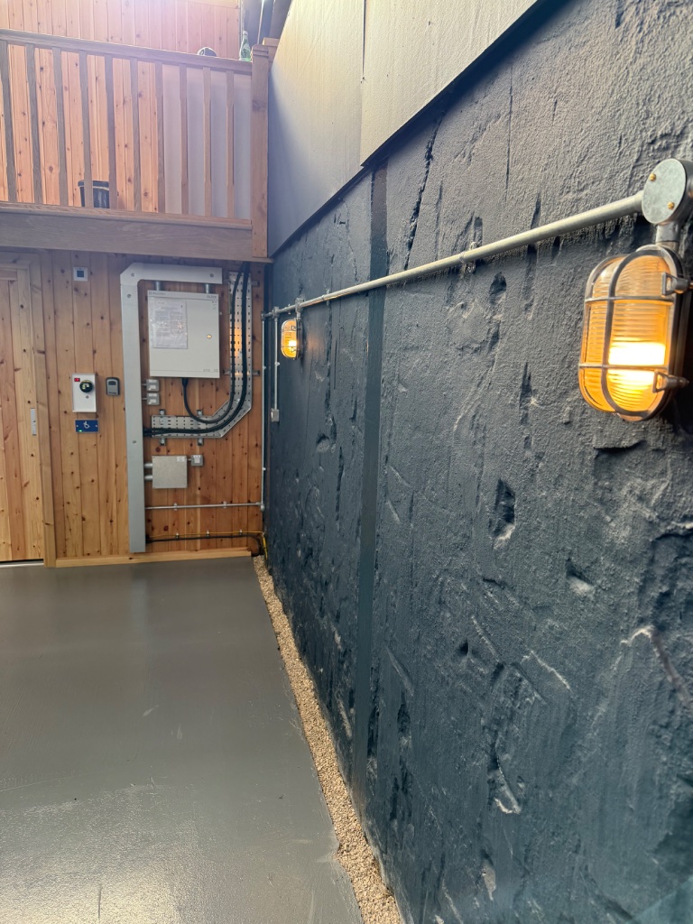 Distribution board, payment terminal, and galvanised containment