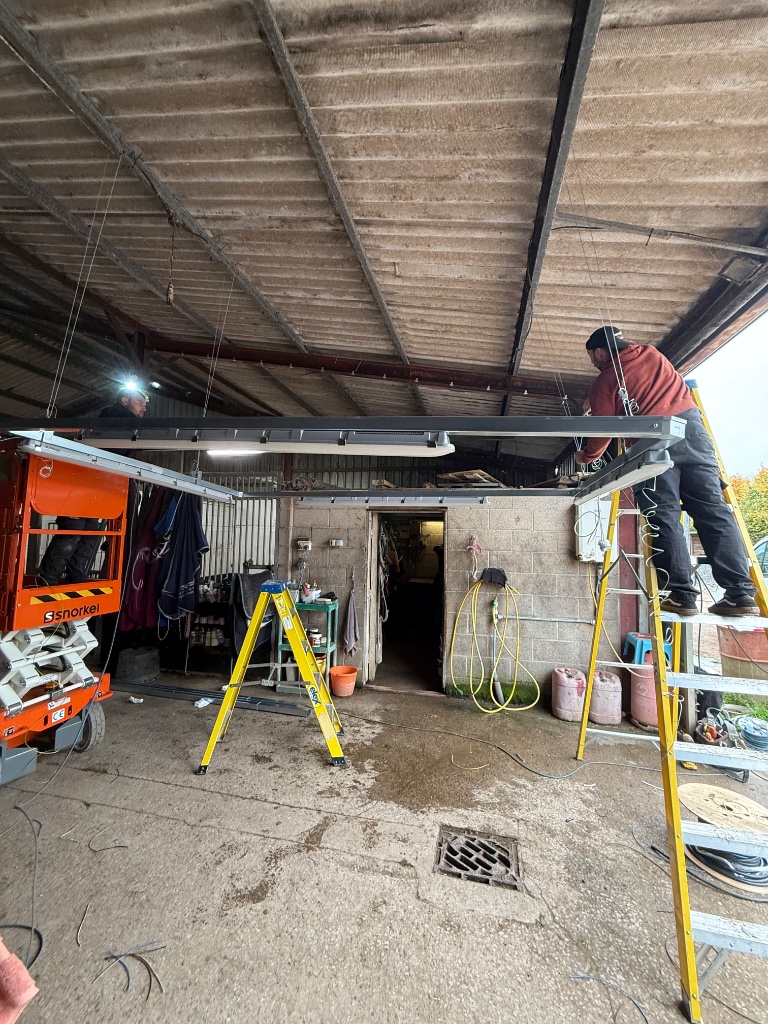 Suspended containment installation underway - scissor lift platform in use