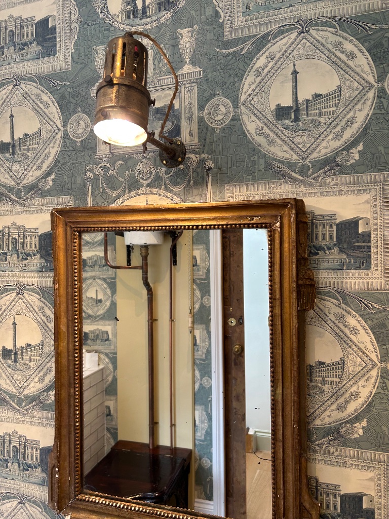 Antique spotlight rewired over ornate gilt mirror