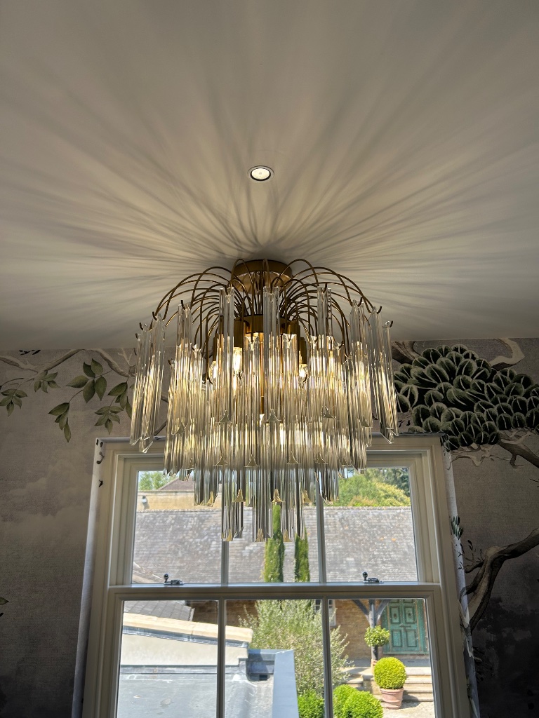 Feature chandelier with ceiling uplighting
