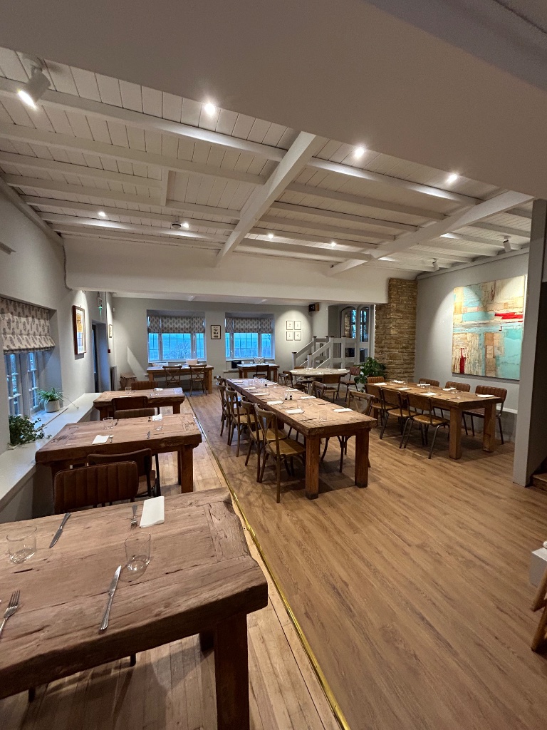 Restaurant dining room - recessed downlights in beamed ceiling