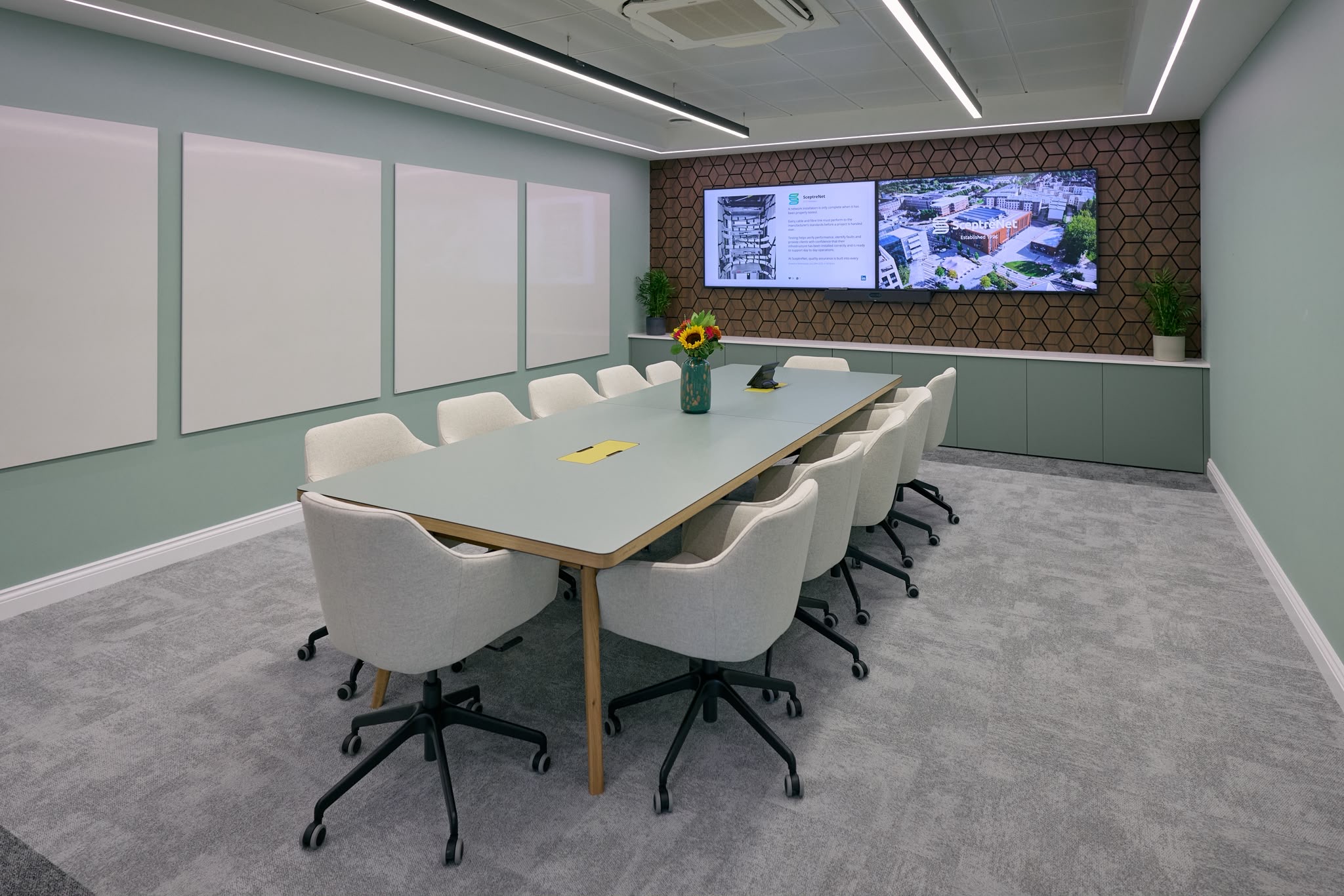 Meeting room with feature wall and recessed linear lighting