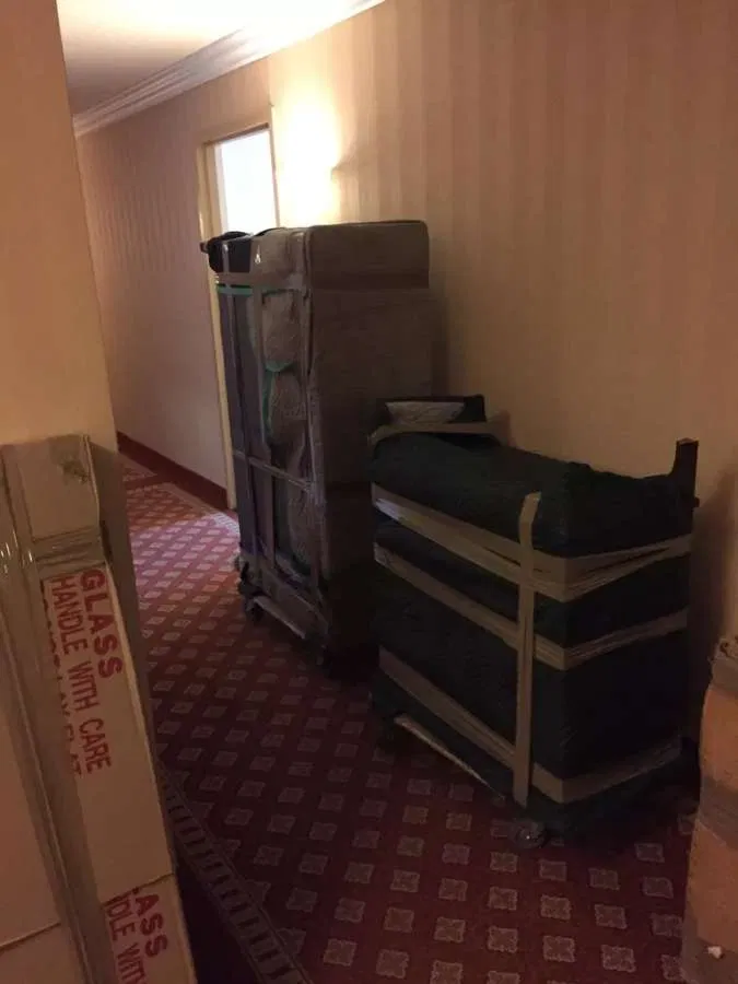 Furniture wrapped & dollied in the hallway