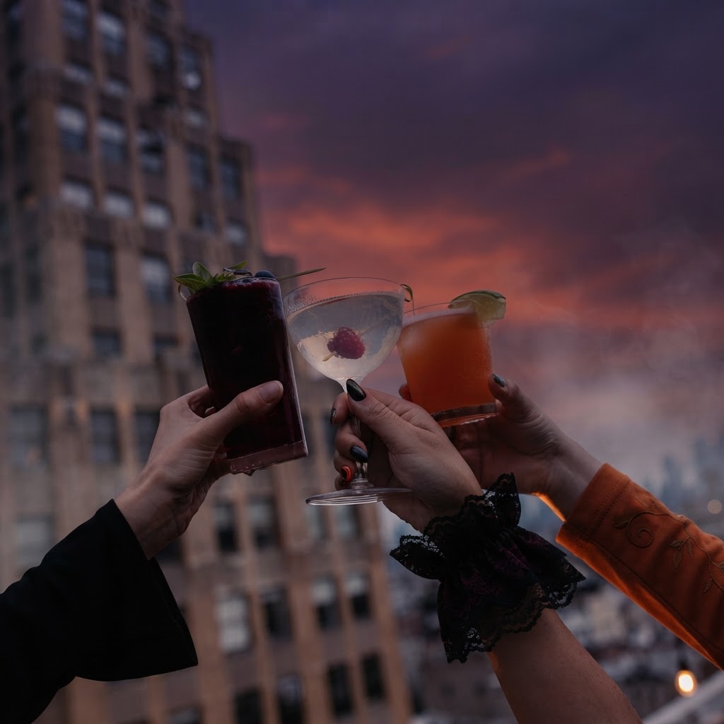 Halloween themed cocktail toast on the rooftop