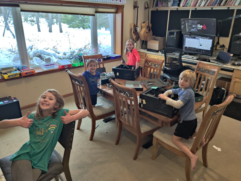 German family children dismantling computers