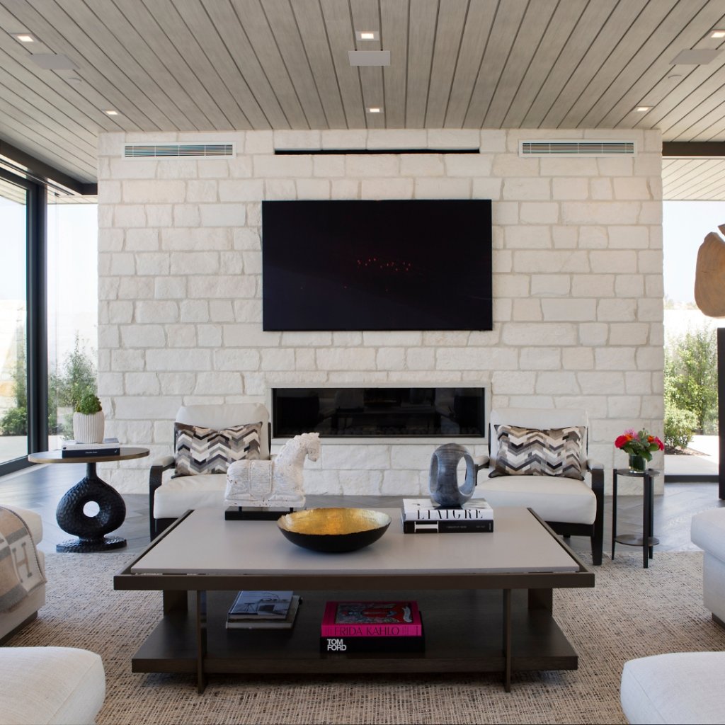 Modern coastal home with open concept living and panoramic ocean views through floor-to-ceiling glass
