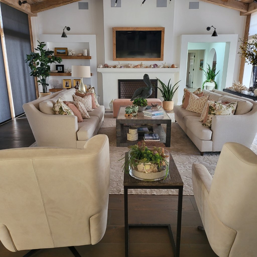 Beachfront living room flowing to outdoor terrace with natural stone and linen textiles