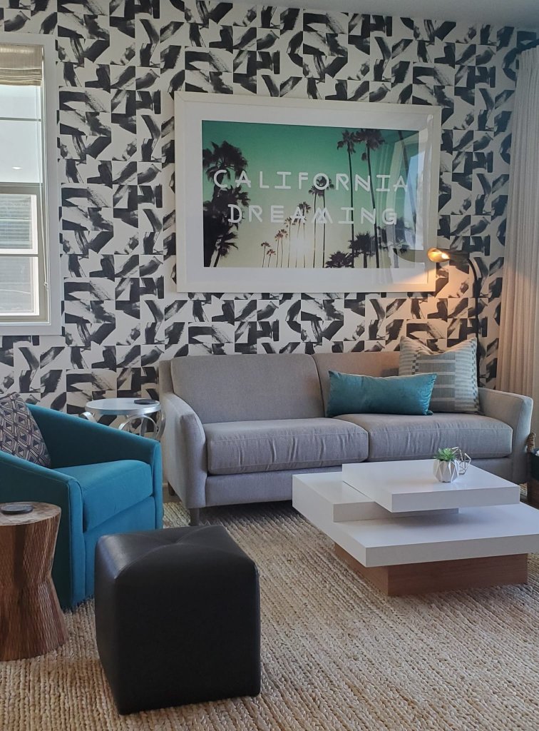 California Dreaming living room with bold patterned wallpaper and teal accents