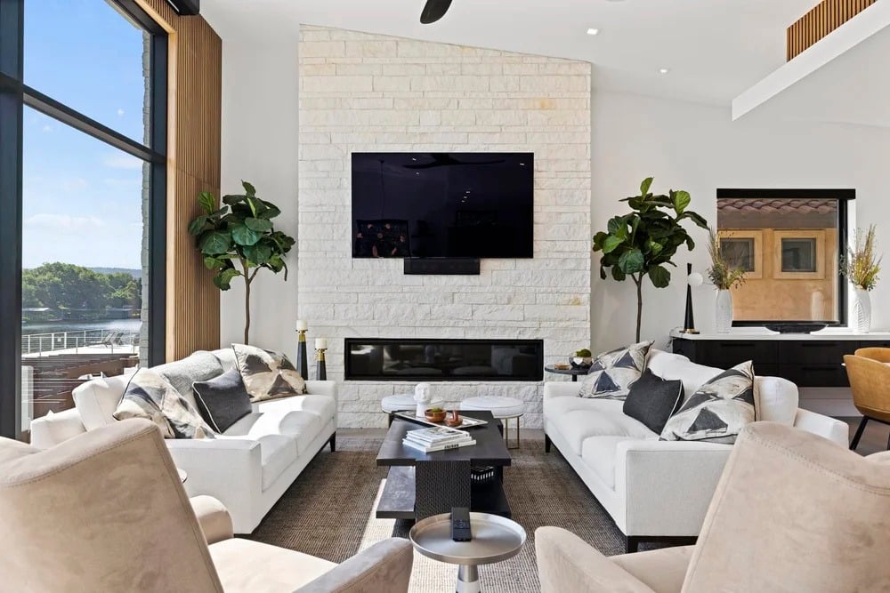 Lakehouse Bliss living room with stone fireplace and lake views