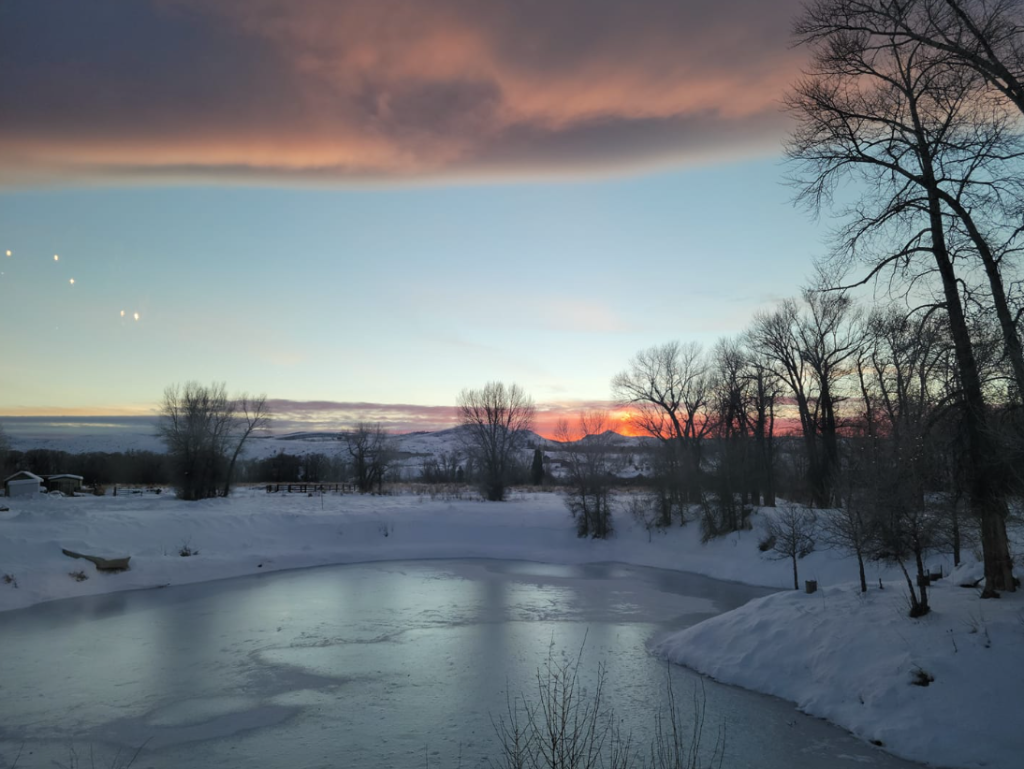 Wyoming winter sky and frozen river near Spirit West