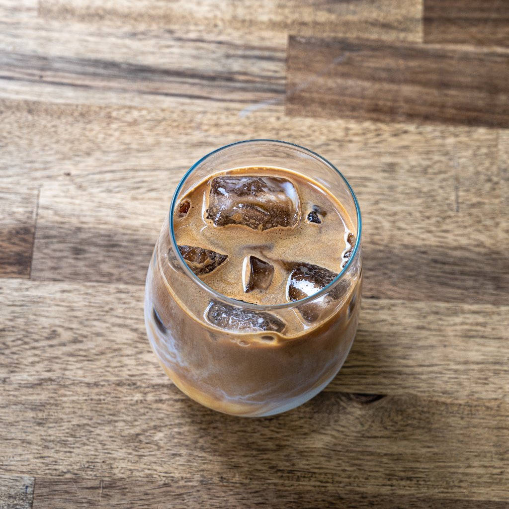 Iced latte made and served from Chloe Eve Coffee mobile trailer