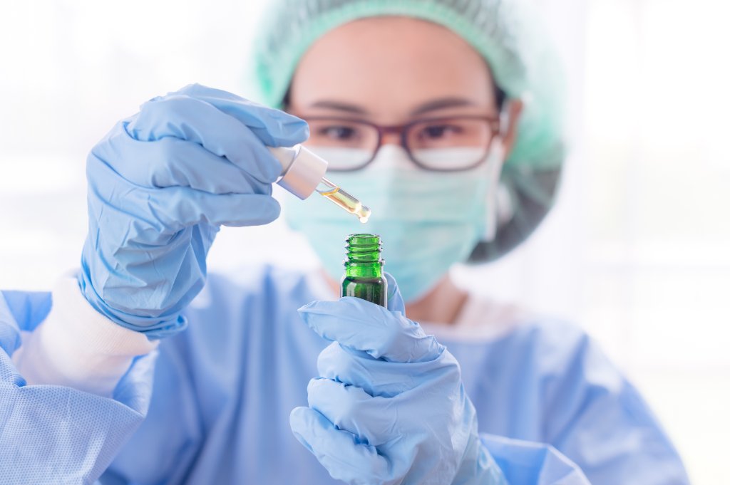 Lab technician with test sample