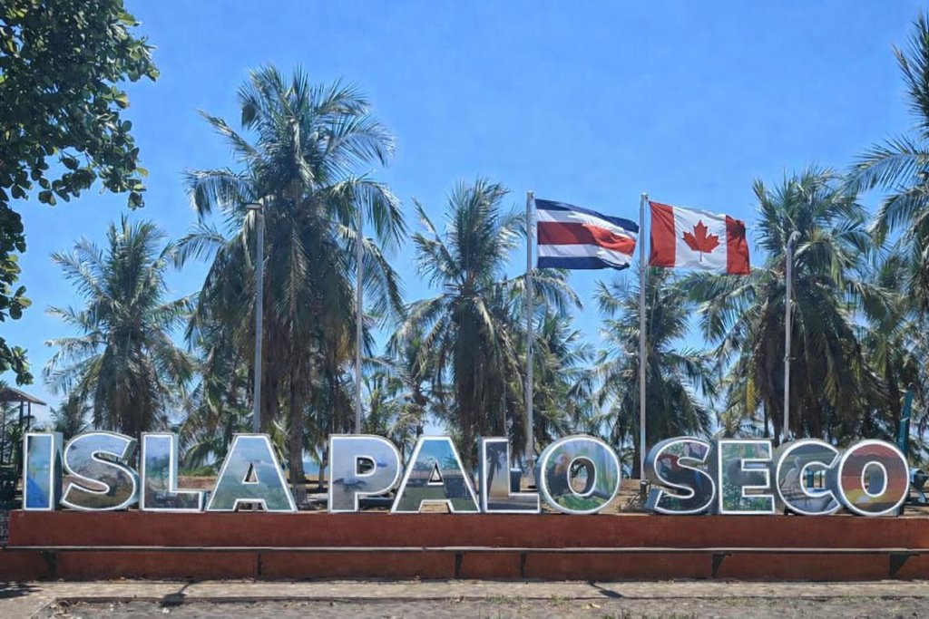 Costa Rica and Canada flags flying together in Isla Palo Seco