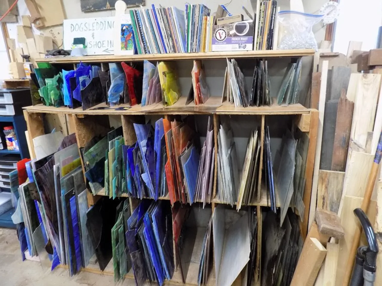 The Glass Collection โ Hundreds of sheets of colored glass organized by hue and texture.