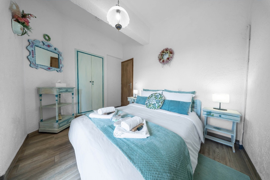 Master bedroom with turquoise accents
