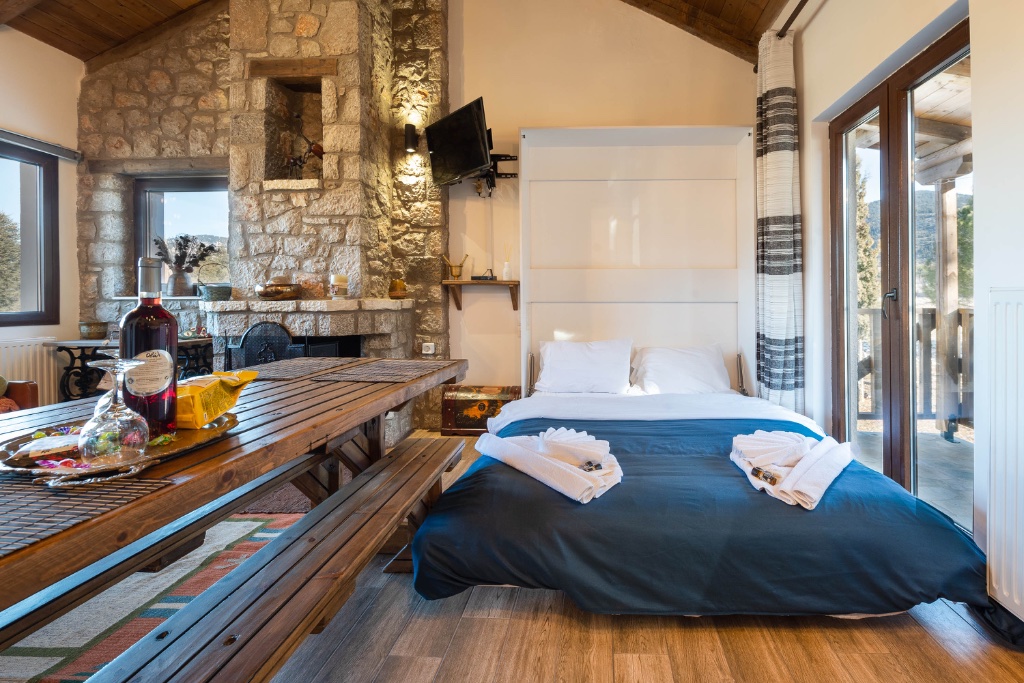 Bedroom with fireplace and sitting area