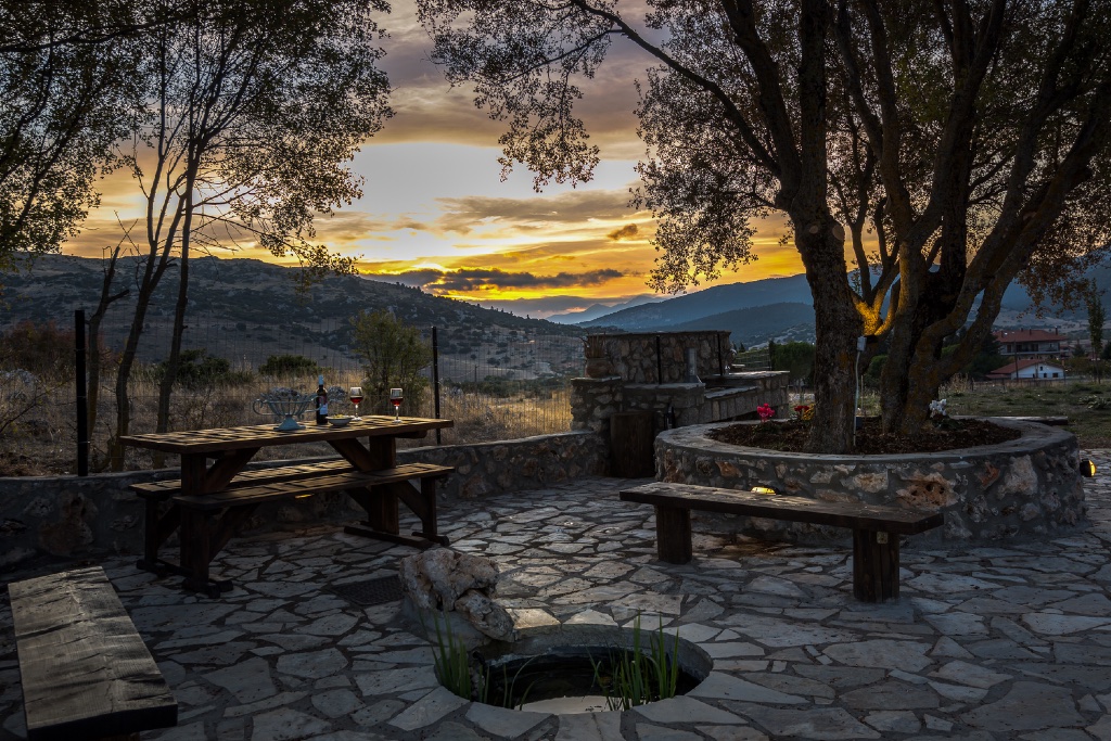 Outdoor terrace at Chalets Renata with mountain sunset view