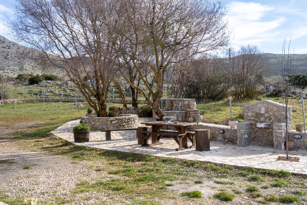 Stone outdoor seating area with mountain backdrop spring