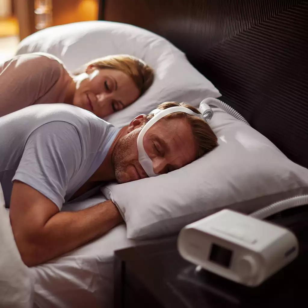 Couple sleeping peacefully with CPAP therapy