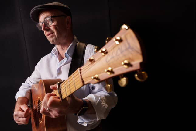 Richard Ings acoustic guitar close up during live performance