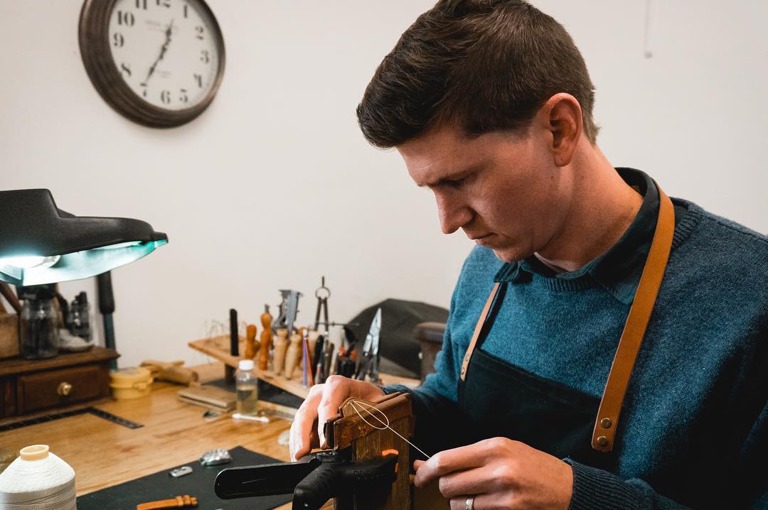 Jacques Lombard saddle-stitching a watch strap by hand