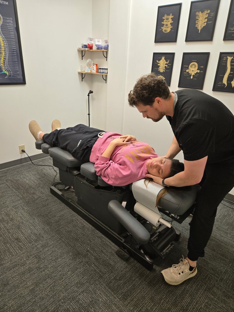 Sports chiropractor treating shoulder pain in Omaha, NE