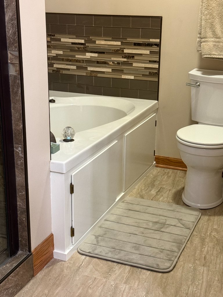 Bathroom with mosaic tile backsplash and painted trim