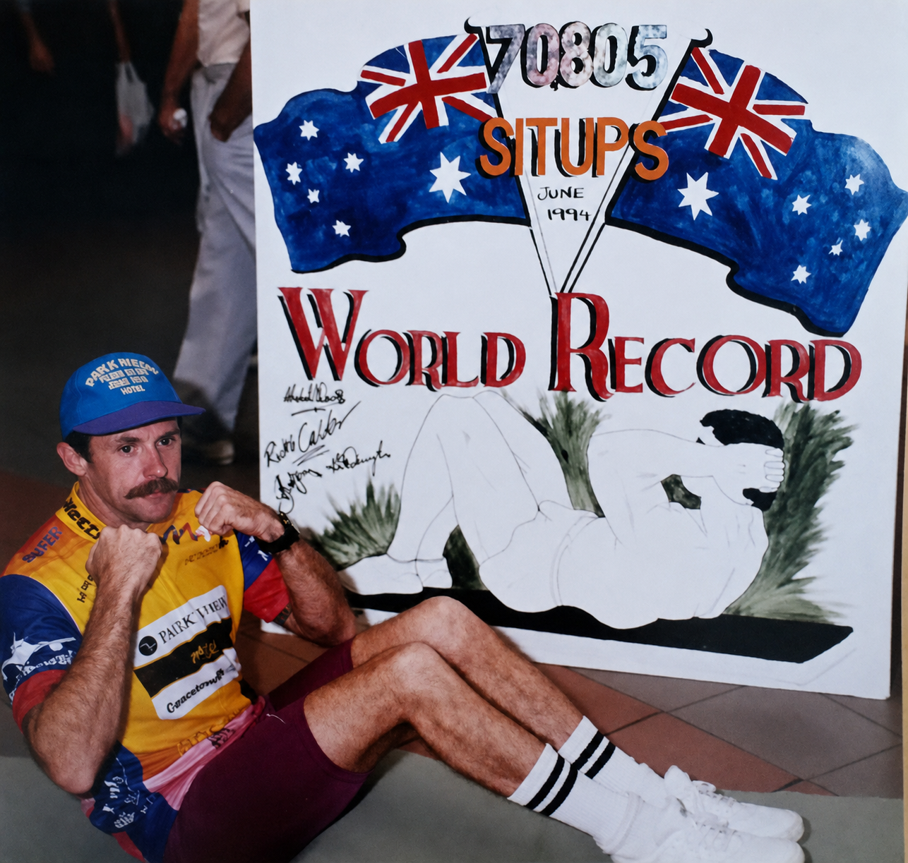 Kevin O'Donoghue in front of his 70,805 sit-ups world record sign