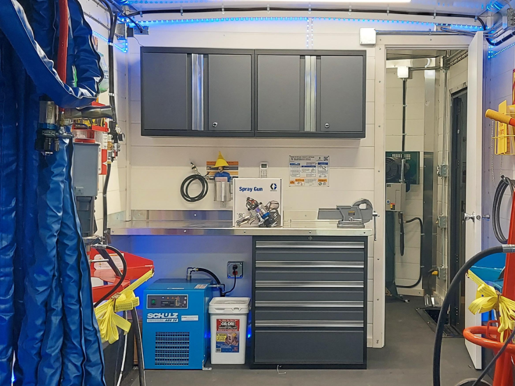 professional spray foam rig interior workstation with equipment service bench and polyurethane processing systems