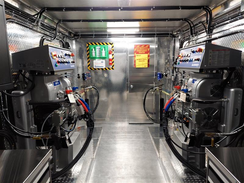 custom spray foam rig interior with dual hydraulic proportioner systems and professional equipment layout