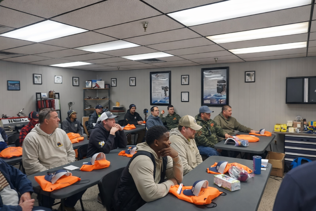 Contractor receiving hands-on spray foam equipment training and operation instruction