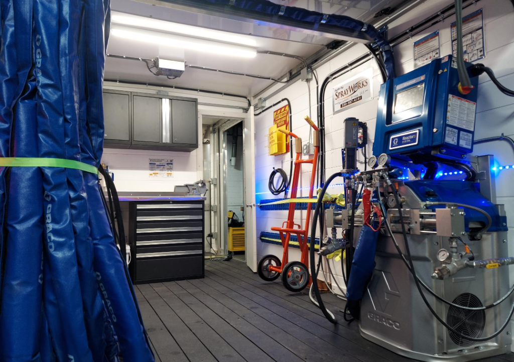 SprayWorks spray foam rig interior — Graco proportioner and equipment layout
