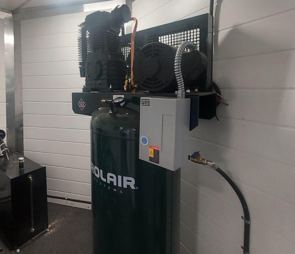 Rolair air compressor system installed in rig interior